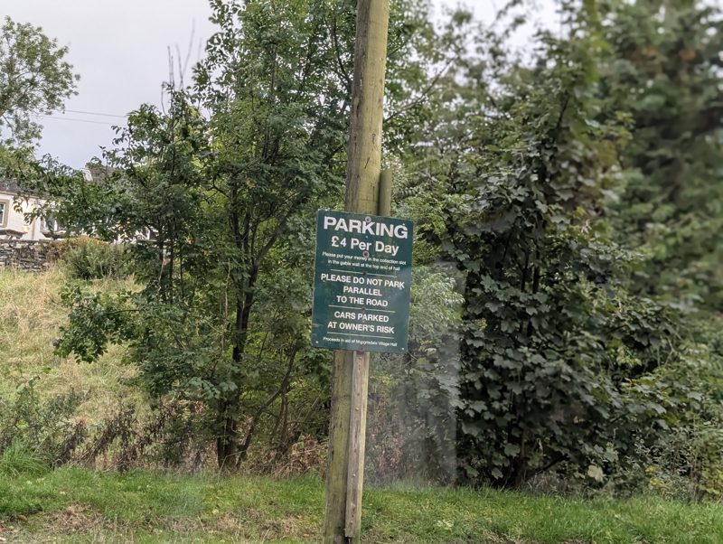Parking sign at Mungrisdale village hall: £4 per day, cars parked at the owner's risk