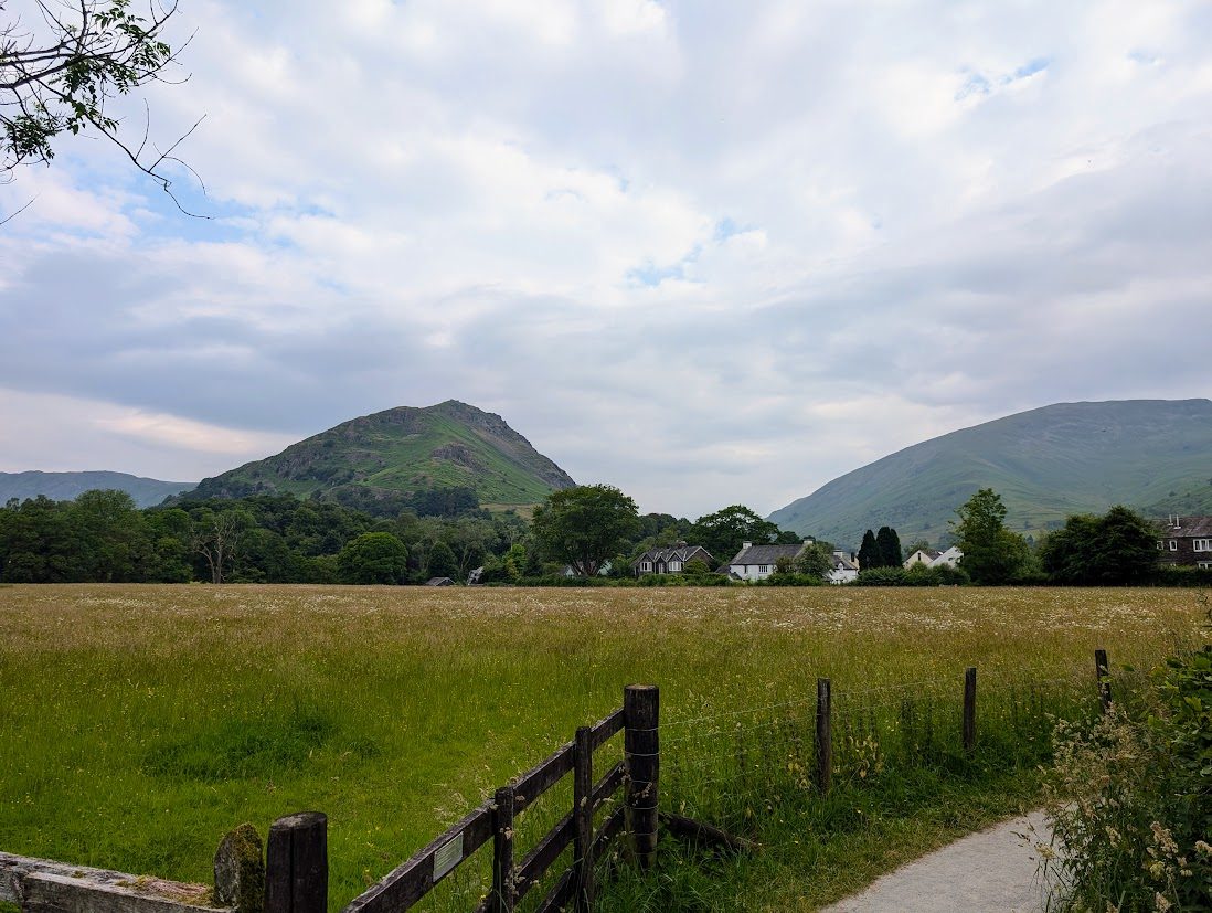 Grasmere village and lake ringed by fells